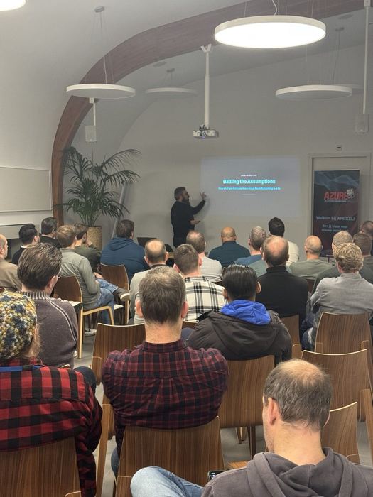 Marc Dekeyser presenting "Battling the Assumptions" to a packed breakout room