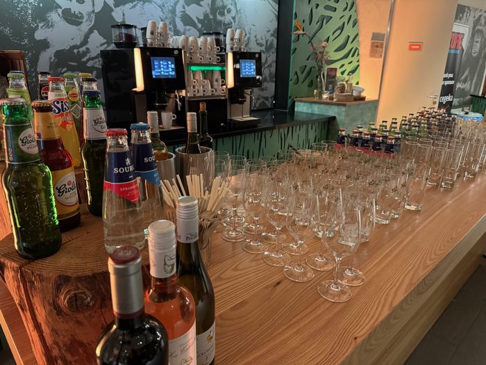 Glasses and bottles lined up in the foyer, ready for the borrel